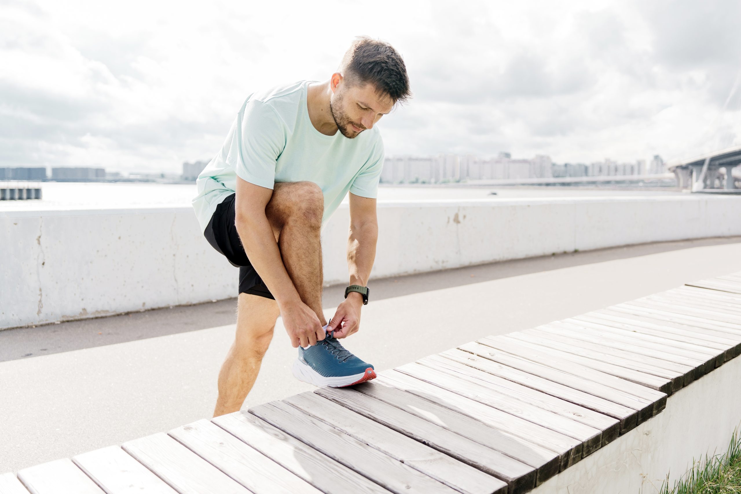 Hormone Replacement Therapy 4 Runner,Tying,Shoelaces,Along,A,Waterfront,Promenade,At,Dawn,In