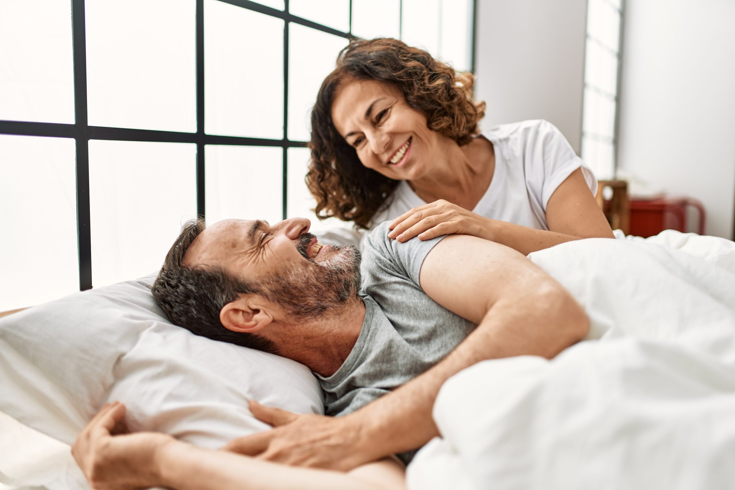 Erectile Dysfunction 4 Middle Age Hispanic Woman Waking Up Her Husband Lying On